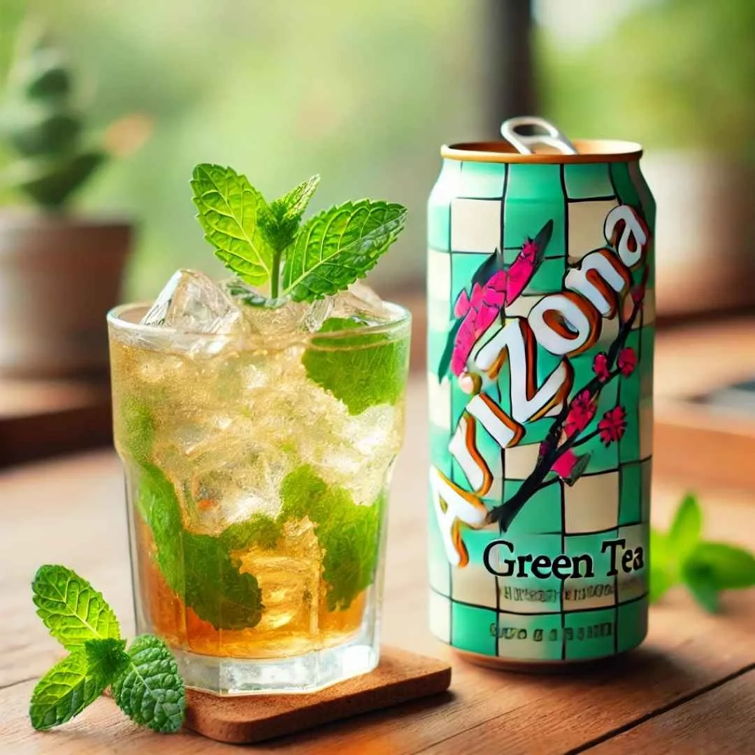 A can of Arizona Green Tea with a glass of iced tea and mint garnish beside it.